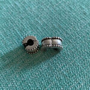 Two clip on stopper charms